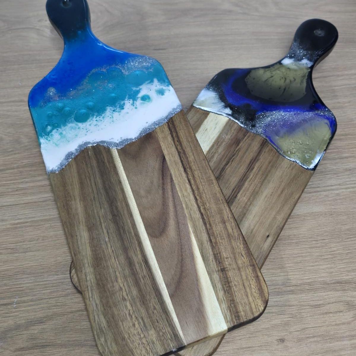 2 boards with blue resin at top of each.