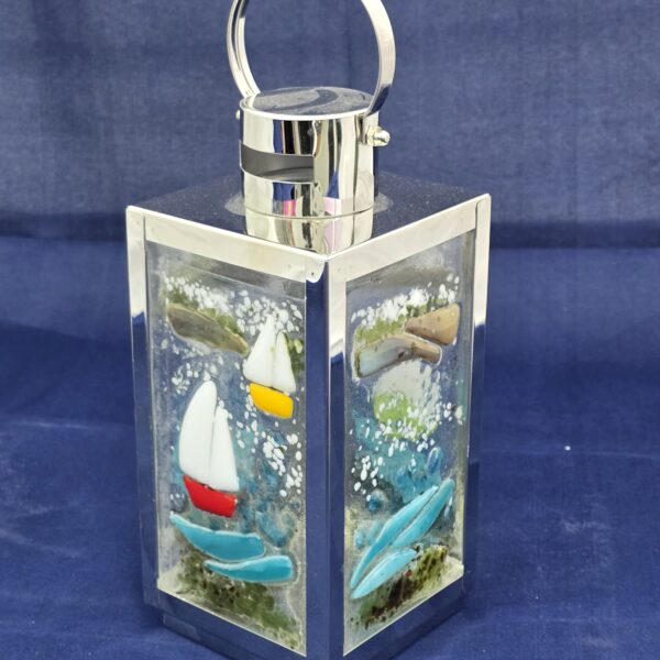 4 sided silver lantern with sea scenes.