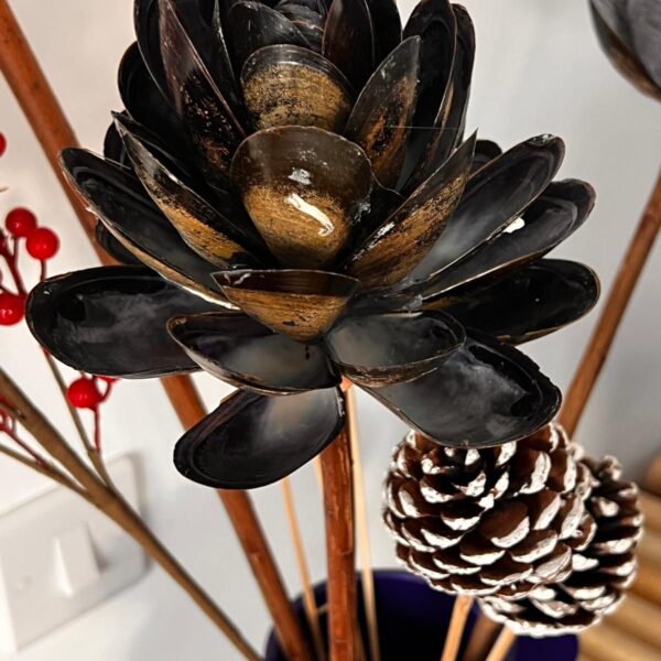 Glossy flower made from shells.
